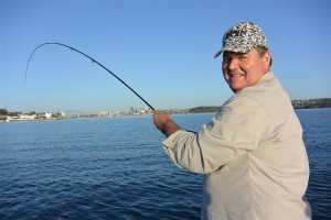 Hooked up to an Aussie salmon on fly within sight of the harbour bridge.